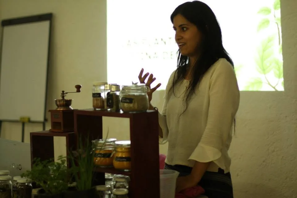 Alicia presenting beside jars and plant materials